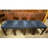 A set of four vintage Harold Fieldman stained wood chairs with laminated curved backs and