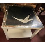 A painted wood two tier tea table with embroidered bird decoration under glass to top - mirrored