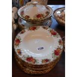 A quantity of Aynsley dinner ware decorated in the Country Roses pattern