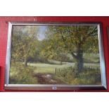 †Peter J. Carter: a silvered gilt framed oil on board, depicting a rural landscape with track in