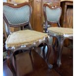 A set of five mahogany framed panel back dining chairs, set on front scroll cabriole legs - for