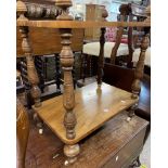 A Victorian walnut veneered two tier stand from a cut down whatnot, with turned supports and white