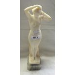 An Art Nouveau style carved alabaster figure of a classical maiden - signed to the base L.