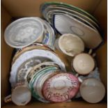 A box containing a selection of ceramic items including jelly moulds, plates, etc.