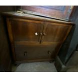 A 63cm Victorian mahogany cabinet with pair of cross banded cupboard doors over deep drawer, set