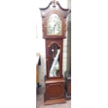 A reproduction mahogany cased Highland granddaughter clock with visible pendulum and faux weights,