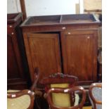 A 1.17m 19th Century mahogany two part linen press with slides enclosed by a pair of panelled