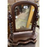 A Victorian mahogany platform dressing table mirror with arched plate and flanking barley twist