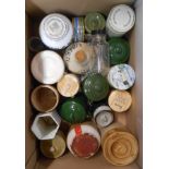 A box containing a selection of ceramic and other storage jars