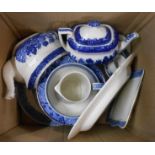 A box containing a quantity of blue and white china including Willow pattern, etc.