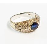 A marked 750 white gold sapphire and diamond encrusted ring - 1 stone missing - setting a/f