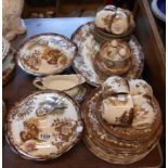 A selection of Palissy pottery dinner and teawares decorated in the Game Series pattern comprising