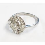 A hallmarked platinum ring with diamond encrusted pierced circular panel - boxed