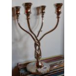 A modern plated metal four branch candelabrum