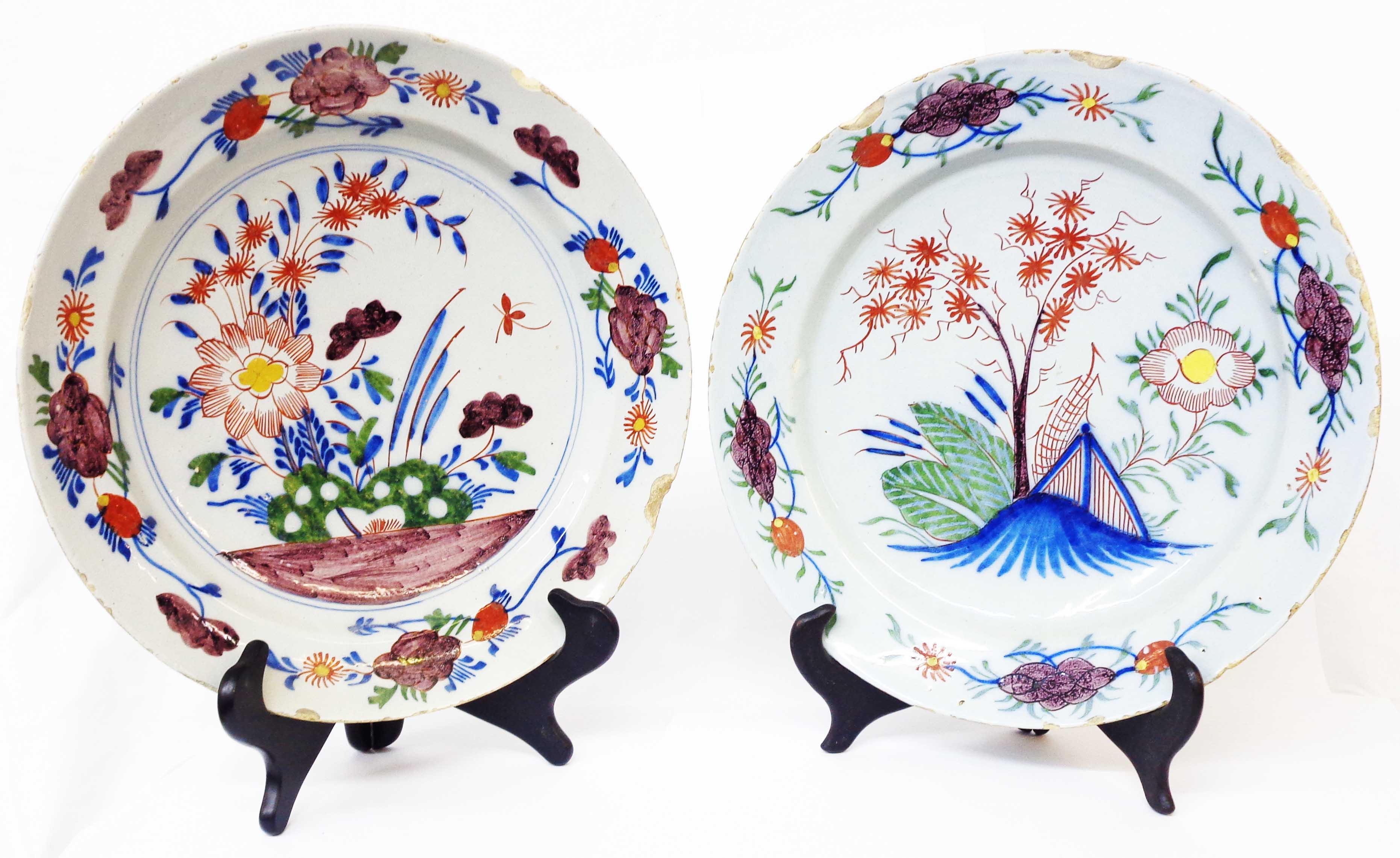 Two similar 18th Century English Delftware polychrome decorated chargers, one decorated with a