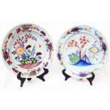 Two similar 18th Century English Delftware polychrome decorated chargers, one decorated with a