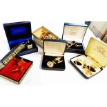A selection of boxed vintage and modern cuff-links and tie pin sets