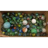 A box containing vintage marbles