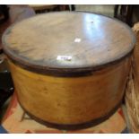 An old bentwood hat box containing a small selection of hats