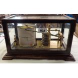 A vintage barograph in glazed wooden case