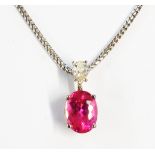 A high carat white metal pendant, set with large oval pink tourmaline and drop shaped diamond to