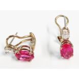 A pair of high carat white metal ear-rings, each set with oval pink tourmaline and drop shaped