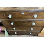 A 1.08m late Victorian wood grained pine chest of four long graduated drawers, set on bracket feet