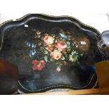 A large Victorian toleware painted tin tray decorated with central floral spray - some overpainting