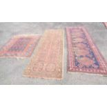A handmade Middle Eastern runner with six repeat motif on blue ground - sold with a 20th Century