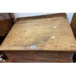 A Victorian stained pine school master's table top writing slope with gallery to top and internal