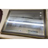 A modern reeded gilt framed bevelled oblong wall mirror