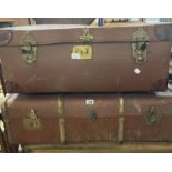 A vintage cane bound and weather coated travelling trunk - sold with a large suitcase with leather