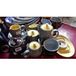 A selection of Denby Stoneware items in the grey/yellow and brown colourways including teapot, jugs,