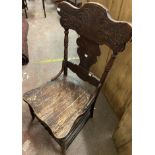 An antique stained wood standard chair with moulded gingerbread back, laminated seat and turned