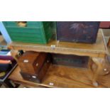 A 94cm reproduction mahogany Long John coffee table with glass inset top