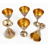 A set of six old Russian parcel gilt stemmed shot glasses