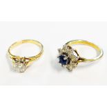 A yellow metal diamond solitaire ring - sold with a paste set dress ring
