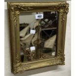 A small gilt gesso framed oblong wall mirror