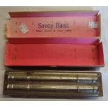 A boxed Savoy Band harmonica