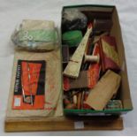 A small box containing assorted collectable items including tins, buttons, harmonica, etc.