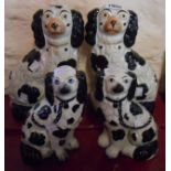 A pair of Victorian Staffordshire comforter spaniels - sold with a similar smaller pair