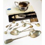 An antique silver fiddle pattern basting spoon, other small silver spoons, Walker & Hall cream jug