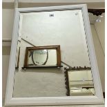 A modern white finish framed bevelled oblong wall mirror