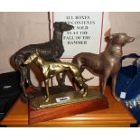 A cast brass greyhound figurine on wooden plinth - sold with another brass model and resin similar