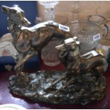 A large resin figurine depicting a greyhound and pup with gold painted finish