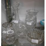 A selection of cut glass items including ship's decanter, vases, powder bowls, etc.