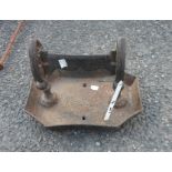 A painted iron boot scraper