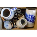 A box containing a small quantity of German Westerwald salt glazed stoneware items including jugs,