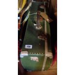 A vintage green aluminium suitcase