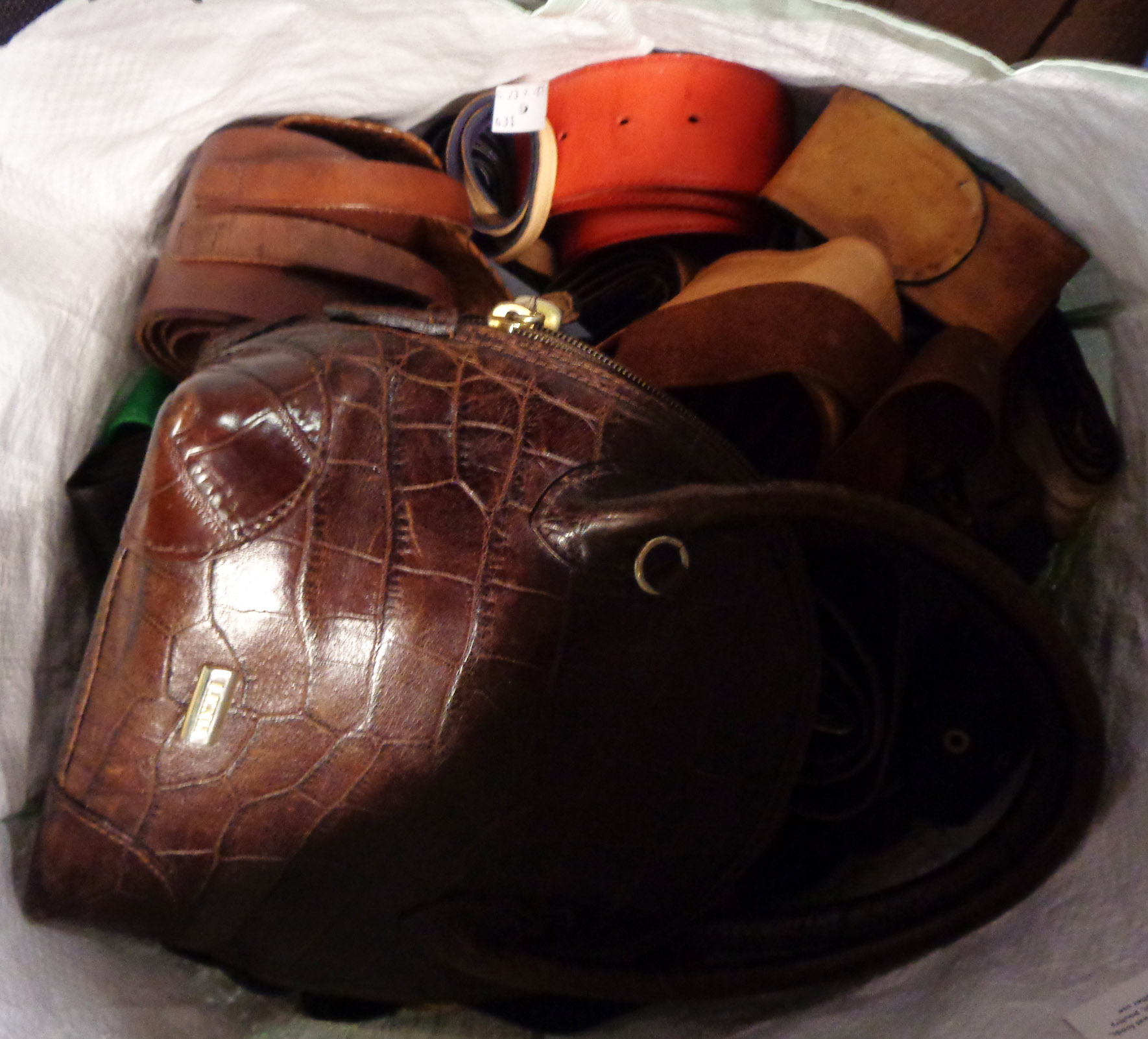 A bag containing a quantity of leather belts, handbag, etc.